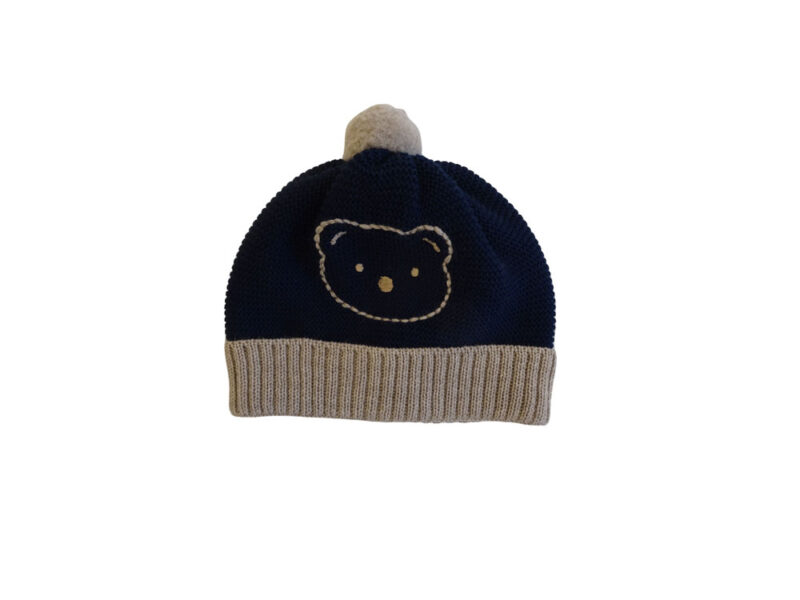 Cappellino con pompon in lana merino Teddy Bear colore blu.
